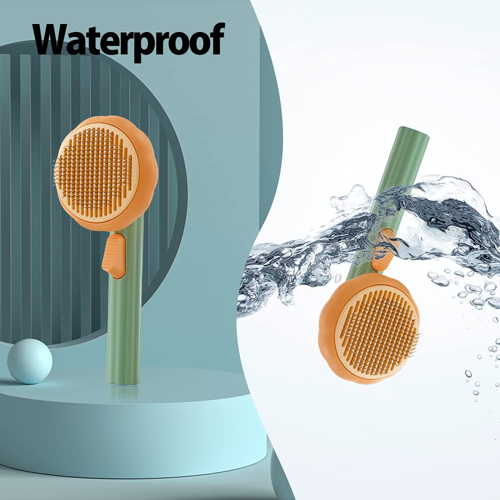 Waterproof pet grooming brush with orange circular head and green handle