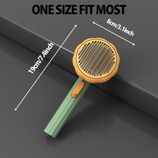 Pet grooming brush with round orange pin head and green handle