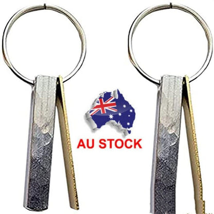 Friendship keychain with round metal ring and two ribbon-like tags in dark and gold.