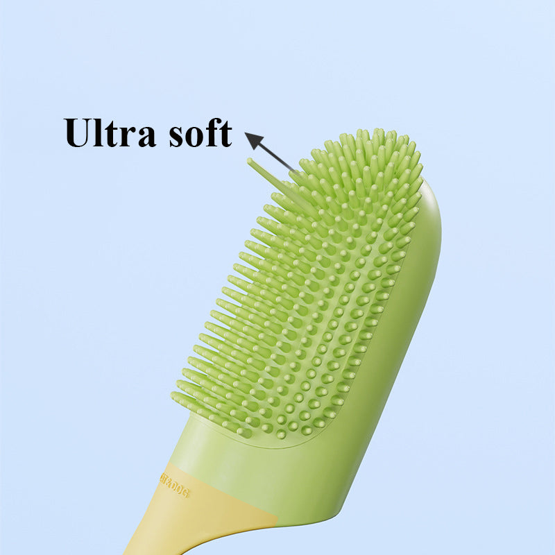 Silicone finger toothbrush with green spiked bristle pad