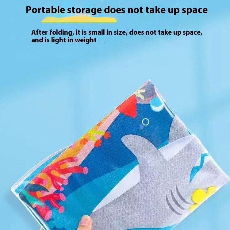 Folded inflatable pet cooling water mat with ocean-theme animal print and blue underside