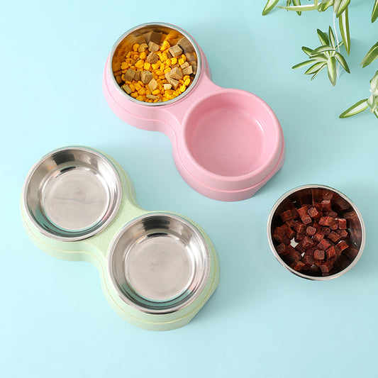 Double pet bowl with two stainless steel dishes on pink base; kibble visible
